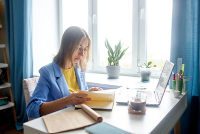 Young woman working at office