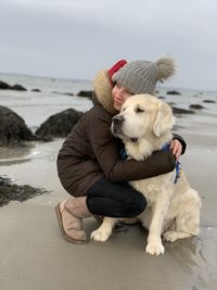 Dog on beach by sea