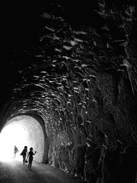 Man walking in tunnel