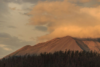 Scenic view of mountains against sky during sunset