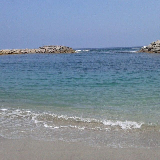 sea, water, clear sky, beach, horizon over water, copy space, shore, tranquil scene, scenics, sand, tranquility, wave, beauty in nature, nature, blue, surf, idyllic, coastline, day, remote