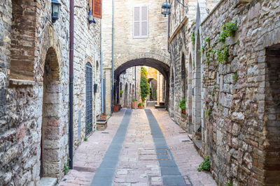 Narrow alley amidst buildings in city