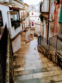 Narrow alley amidst buildings in city