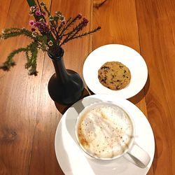 High angle view of coffee served on table