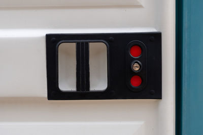 Close-up of telephone booth on wall