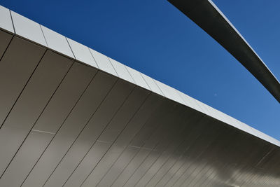 Low angle view of bridge against clear blue sky