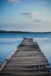 Pier over sea against sky