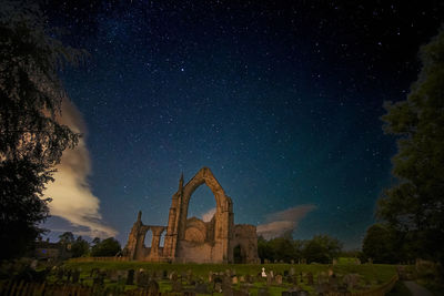Bolton abbey against sky at night