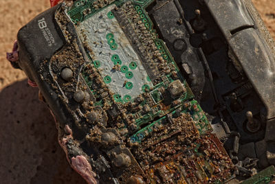 High angle view of rusty metal on field