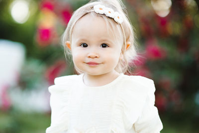 Portrait of cute girl standing outdoors