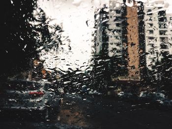 Close-up of wet car window in rainy season