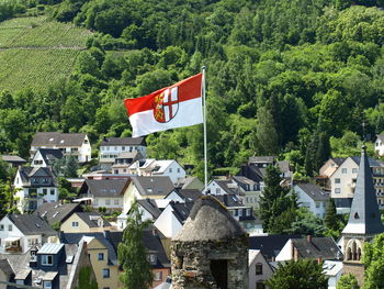 Houses and trees against sky