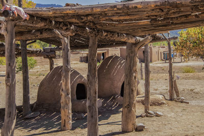 Old ruin on field by building