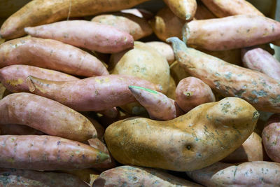 Full frame shot of sweet potatoes for sale at market stall