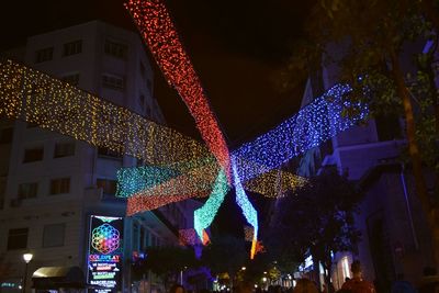 Low angle view of illuminated building at night