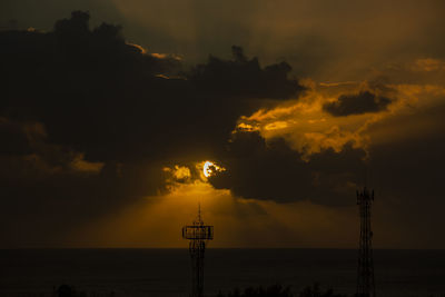 Sunset over the ocean in the village of albion, mauritius.