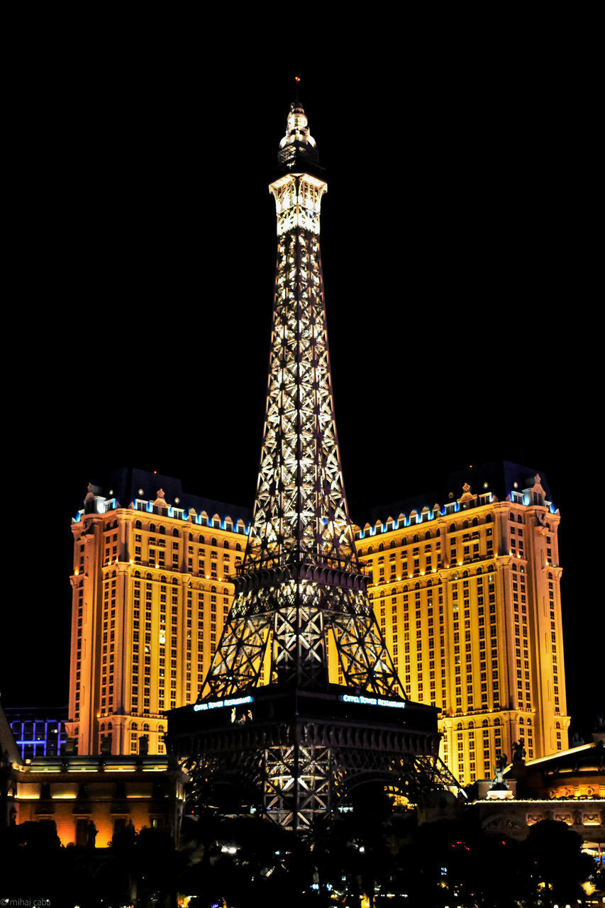 LOW ANGLE VIEW OF ILLUMINATED BUILDINGS AGAINST SKY