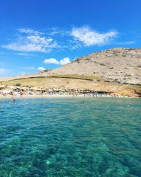 Scenic view of sea against blue sky