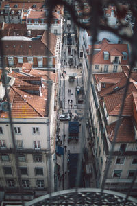 High angle view of houses in town seen through window