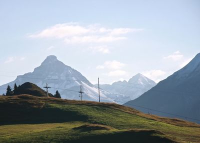 Scenic view of snow covered mountains against sky