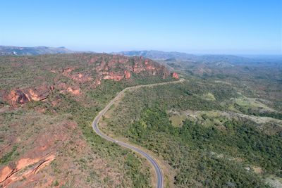 High angle view of land against clear blue sky