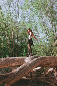 Full length of woman in forest