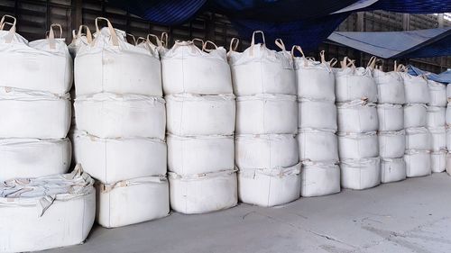 Stacked of bags on floor