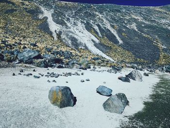 High angle view of rocks on shore during winter