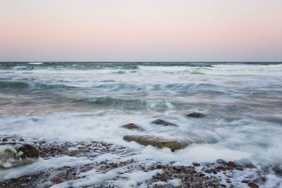 Scenic view of sea against sky during sunset