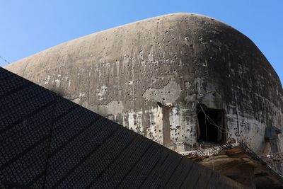 Low angle view of old building against clear sky