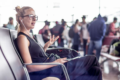 Side view of woman using smart phone