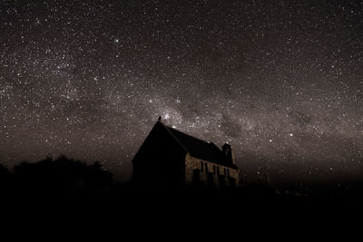 Low angle view of building against sky at night