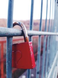 Close-up of padlocks on railing