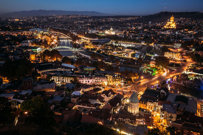 High angle view of illuminated city at night