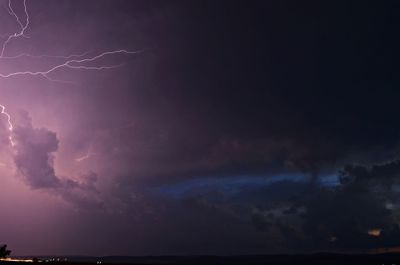 Low angle view of lightning in sky at night