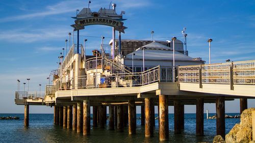 View of pier on sea against sky