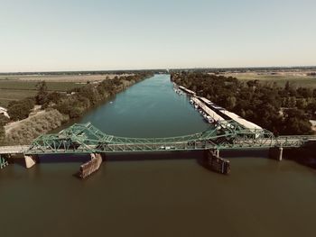Scenic view of bridge over river against clear sky