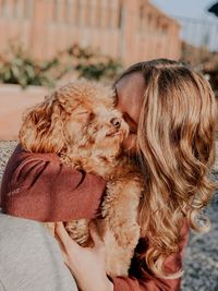 Midsection of woman with dog