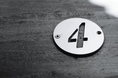 Close-up of information sign on table