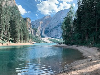 Scenic view of lake and mountains against sky