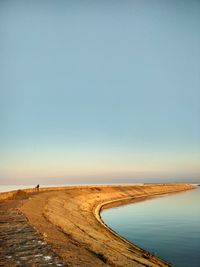 Scenic view of beach against clear sky