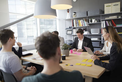 Smiling people at business meeting