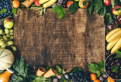 High angle view of fruits and leaves on table