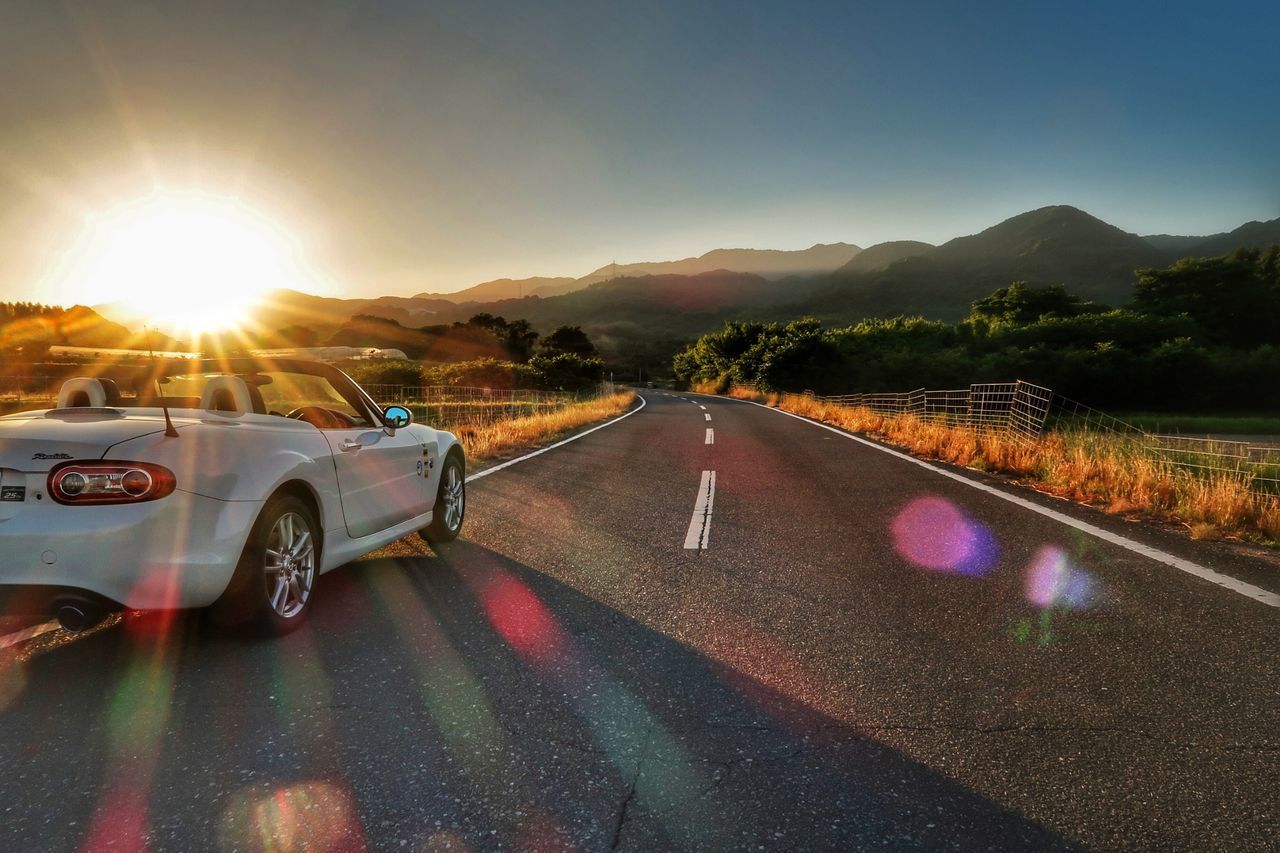 ROAD AGAINST SKY AT SUNSET