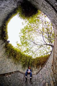 Man standing by wall