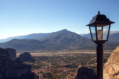 Built structure on mountain against clear blue sky