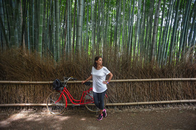 Full length of a man standing in forest