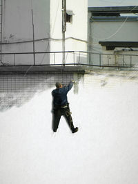 Woman standing on footbridge