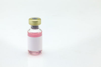 High angle view of bottle against white background