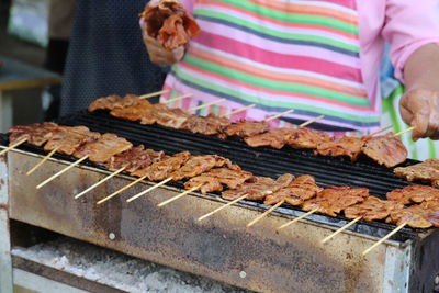 Full length of woman on barbecue grill